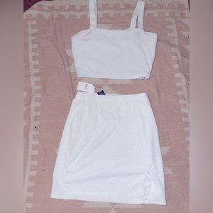 Tank with matching skirt, both new with tags.